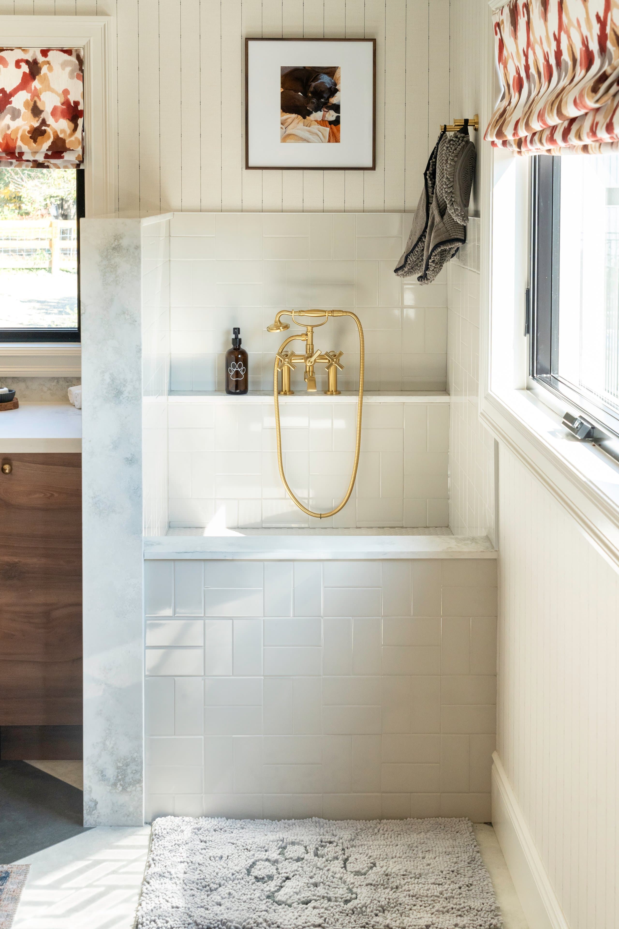 a bathroom space featuring a stylish shower area