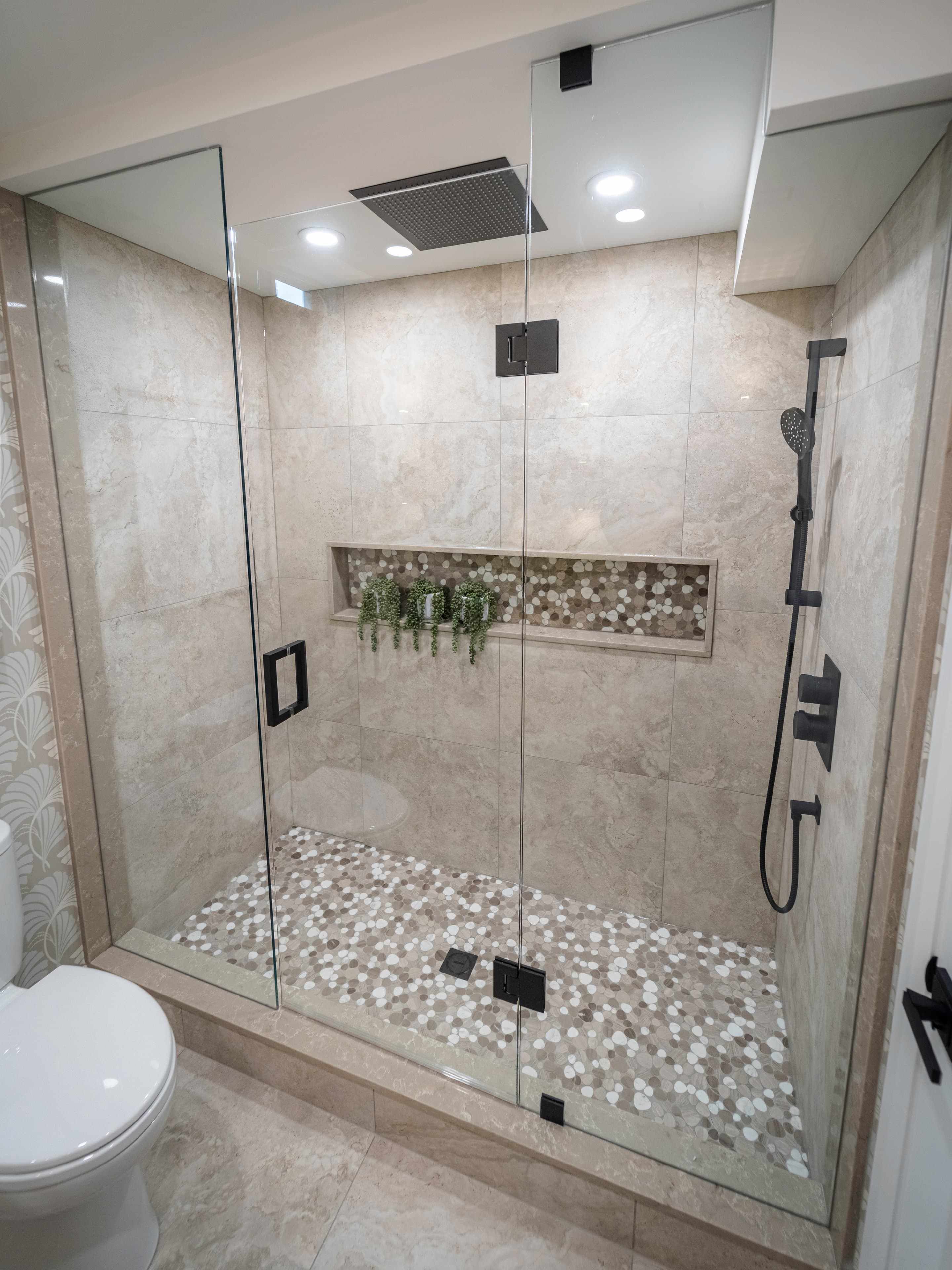varying mosaic tiles, and sleek matte black fixtures