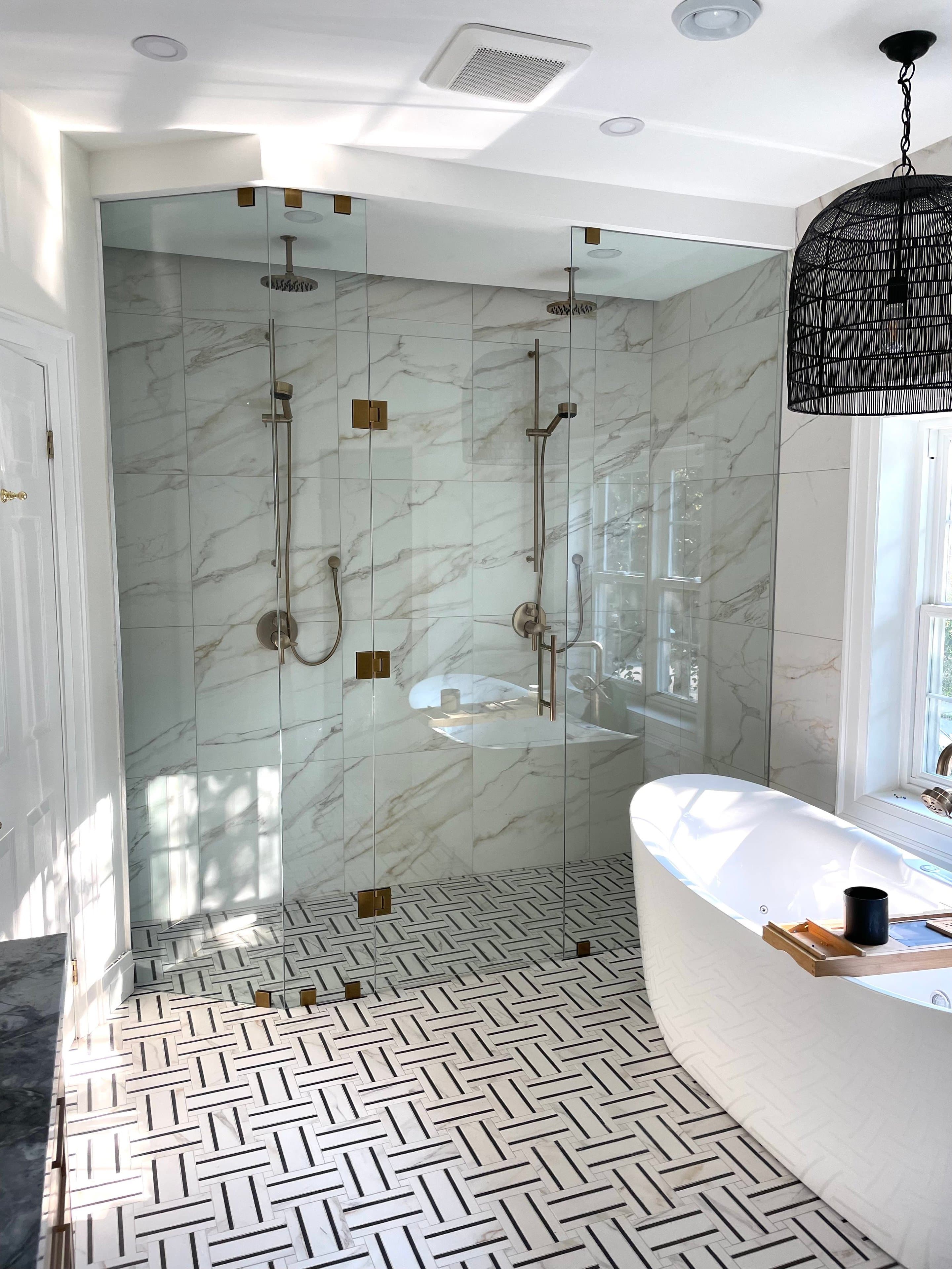 Luxurious modern bathroom with marble finishes and elegant detailing.